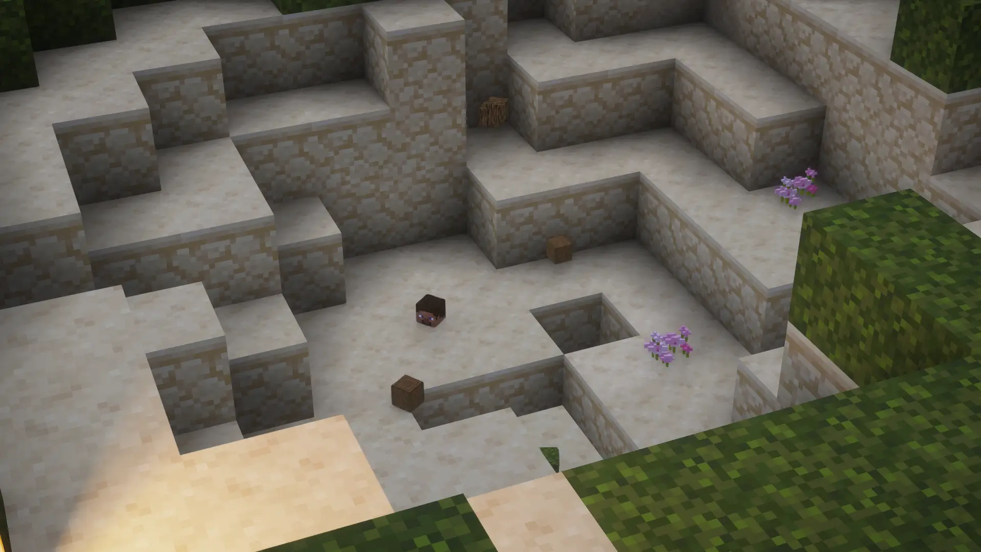 Ein Spielerkopf liegt in dem Krater einer aufgeladenen Creeper-Explosion